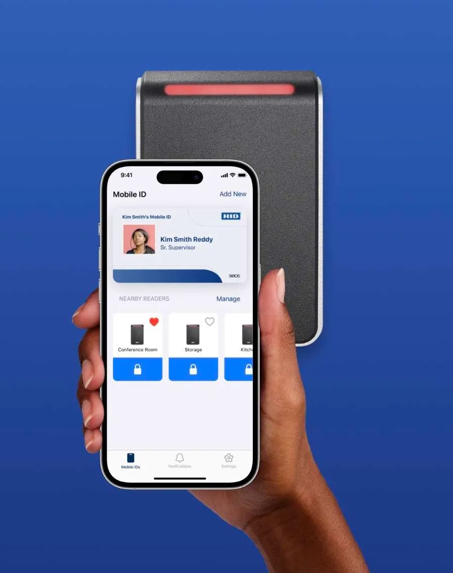 A hand holding the HID Mobile Access app in front of an HID reader.
